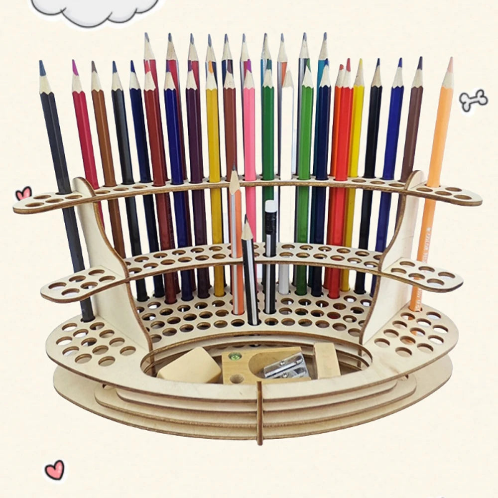 A wooden organizer holds numerous colored art brushes and pencils in individual slots.