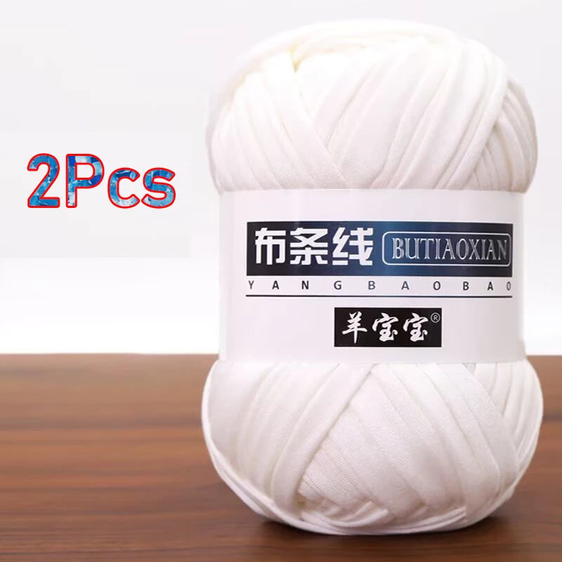 A ball of white soft chunky t-shirt yarn for crochet and knitting, packaged as a 2-pack.