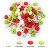 A collection of silicone lentil beads in various colors including snow white, natural beige, red, and lime green, arranged on