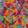 A close-up view of a large pile of solid color pony beads in various shades including red, orange, purple, green, and blue.