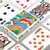 A box of classic joker poker playing cards featuring colorful, patterned designs.