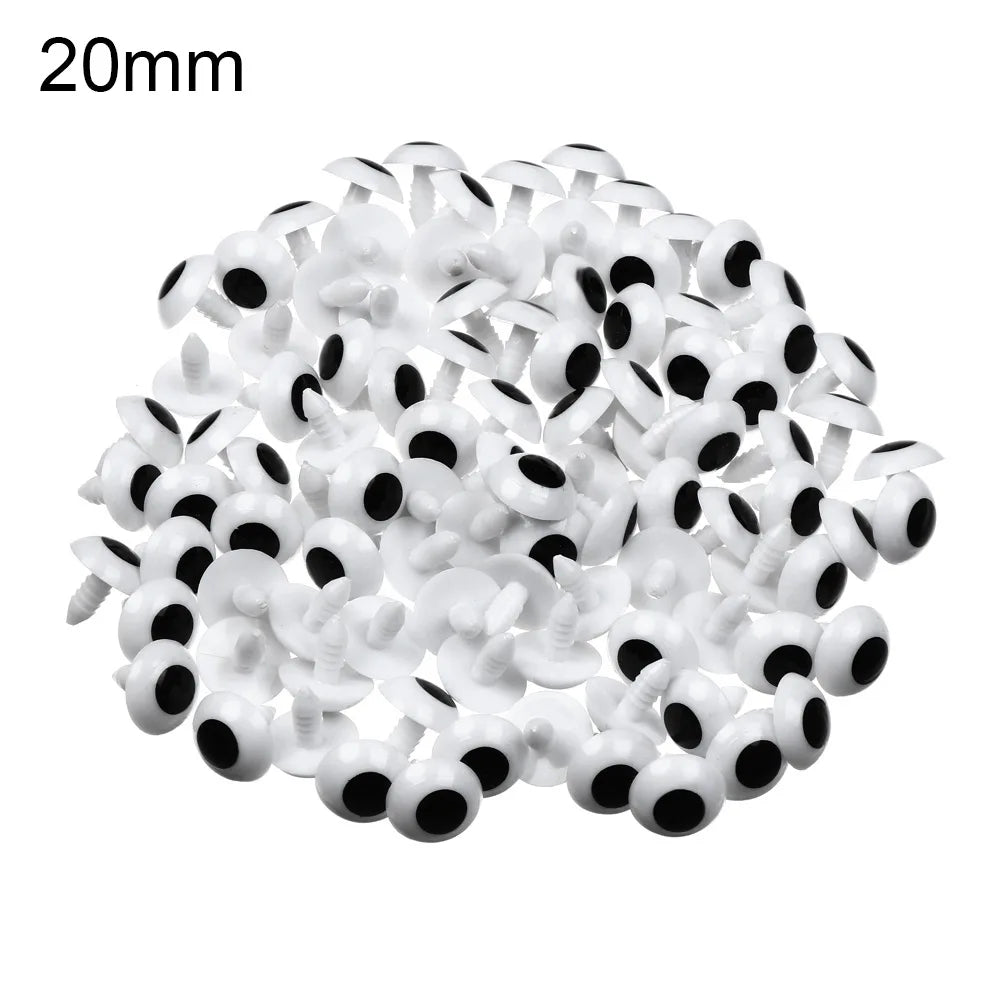 A pile of white plastic safety eyes with black pupils, measuring 20mm.
