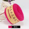 A bright pink ball of silk mohair blended yarn is displayed next to a gold-colored label.