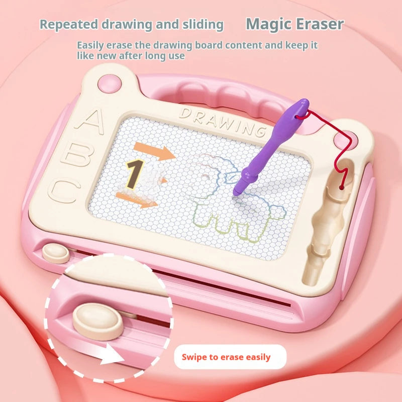 A pink magnetic drawing board for kids with a grid surface and a purple eraser tool is shown.