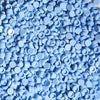 A pile of small, round, light blue plastic beads used for DIY squishy toys and stress relief crafts.