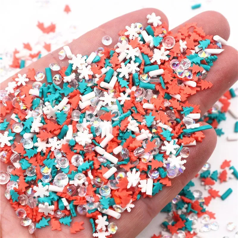 A hand holds a pile of colorful polymer clay slices in red, white, and teal for DIY crafts.