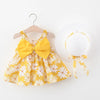 A yellow floral baby girl summer dress and sunhat set with a matching bow detail.