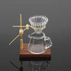 A miniature hand-brewed coffee stand set for dollhouse featuring a glass teapot and a pourer.