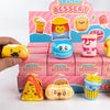 A hand holds a box of squishy dessert toys featuring cute animal and food blind box collectibles.