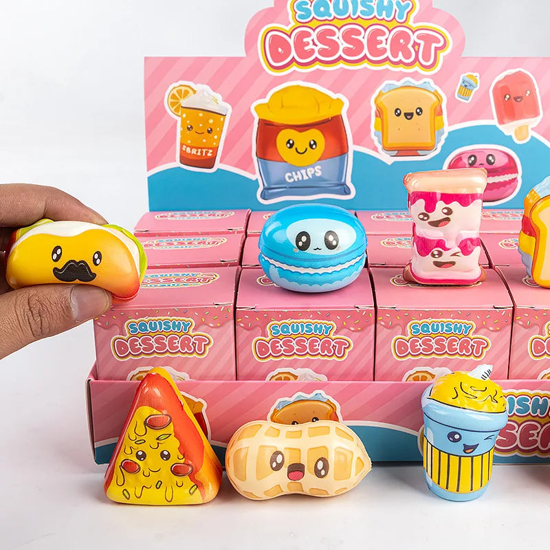 A hand holds a box of squishy dessert toys featuring cute animal and food blind box collectibles.