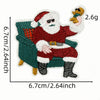 Iron-on patch of Santa Claus sitting in a green armchair with a yellow elf