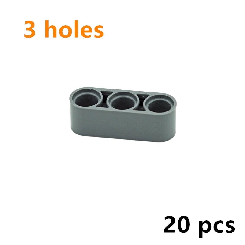 A gray Technic liftarm beam with three holes, sold as a 20-piece set of building blocks.
