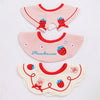 A set of three pink and yellow baby waterproof drool bibs with strawberry and floral designs