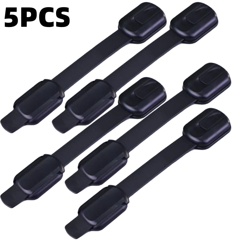 Five black adhesive baby safety locks for cabinets and drawers