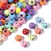 A collection of colorful rhinestone acrylic spacer beads in various shades and sizes.