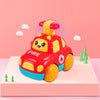 A red fire truck pull-back toy car with a yellow siren on a pink background.