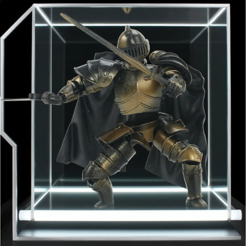 A detailed articulated paladin action figure in gold and black armor wielding a sword displayed in a clear acrylic box.