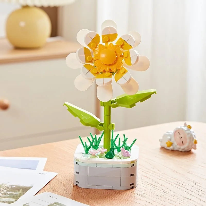 A set of rose flower building blocks featuring yellow and white petals and green stems.