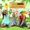 A group of children are posing with a set of hand puppet animals for play.
