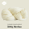 A ball of cream-colored Merino wool yarn, hand-picked by Lirisnly, shown in a close-up.