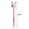 A white bunny-shaped spoon for an Easter egg and spoon race game set.