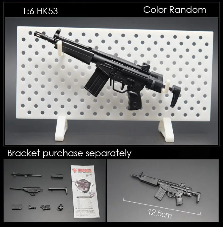 A black 1/6 scale military submachine gun model kit is displayed on a white pegboard with separate bracket parts.
