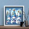 A framed painting featuring three blue and white Christmas gnomes with sparkling stars and dripping blue paint.