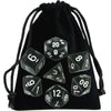 A black drawstring bag containing a set of transparent polyhedral dice for role-playing games