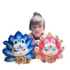A person holds a building block set depicting a nine-tailed fox character in blue and white.