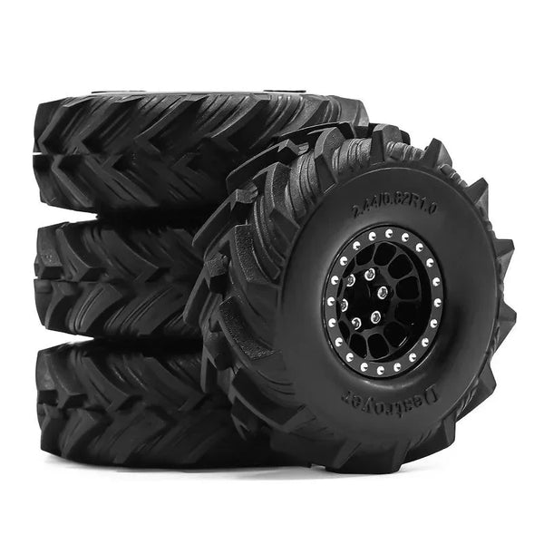 A stack of black metal beadlock wheel tires for RC crawlers.