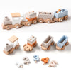 A set of wooden train toys numbered 1 through 5, designed for Montessori educational play.