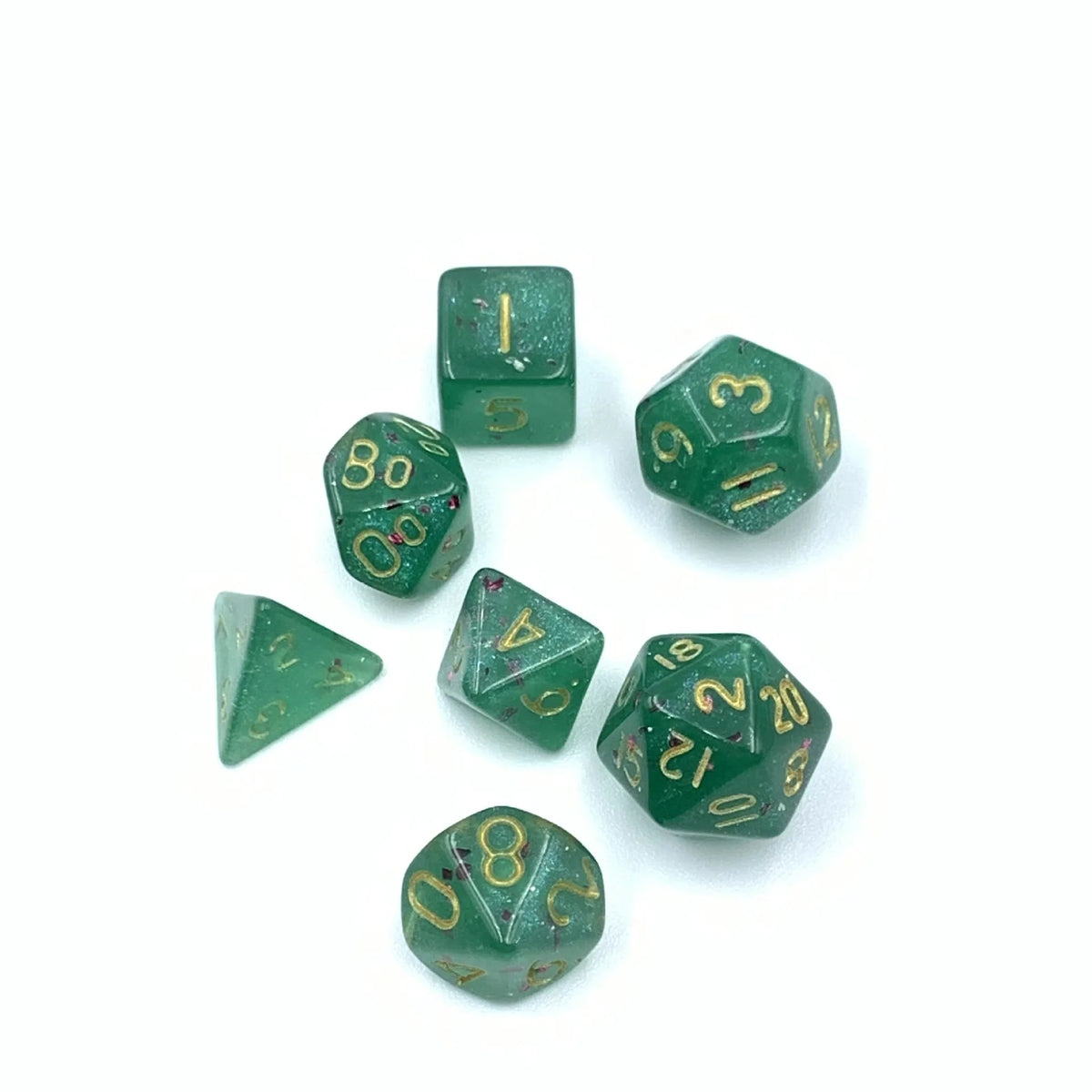 A collection of seven green acrylic dice, including a standard d6 and various numbered dice, scattered on a white surface.