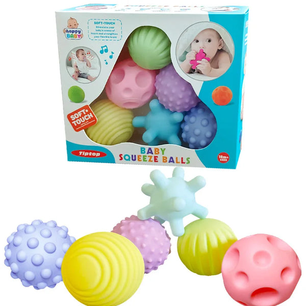 A box of baby squeeze balls in various colors including green, pink, purple, and yellow, with some balls displayed outside th