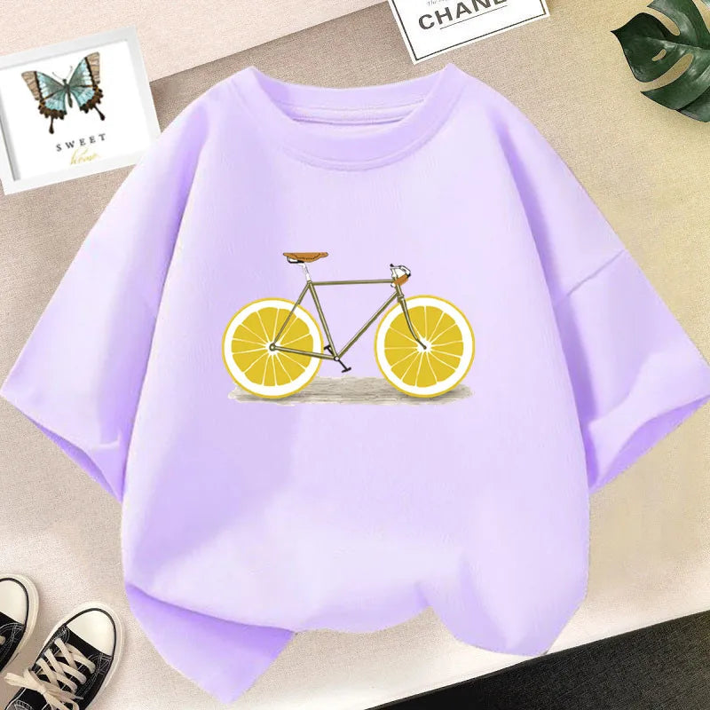 Light purple graphic t-shirt featuring a bicycle with lemon wheels