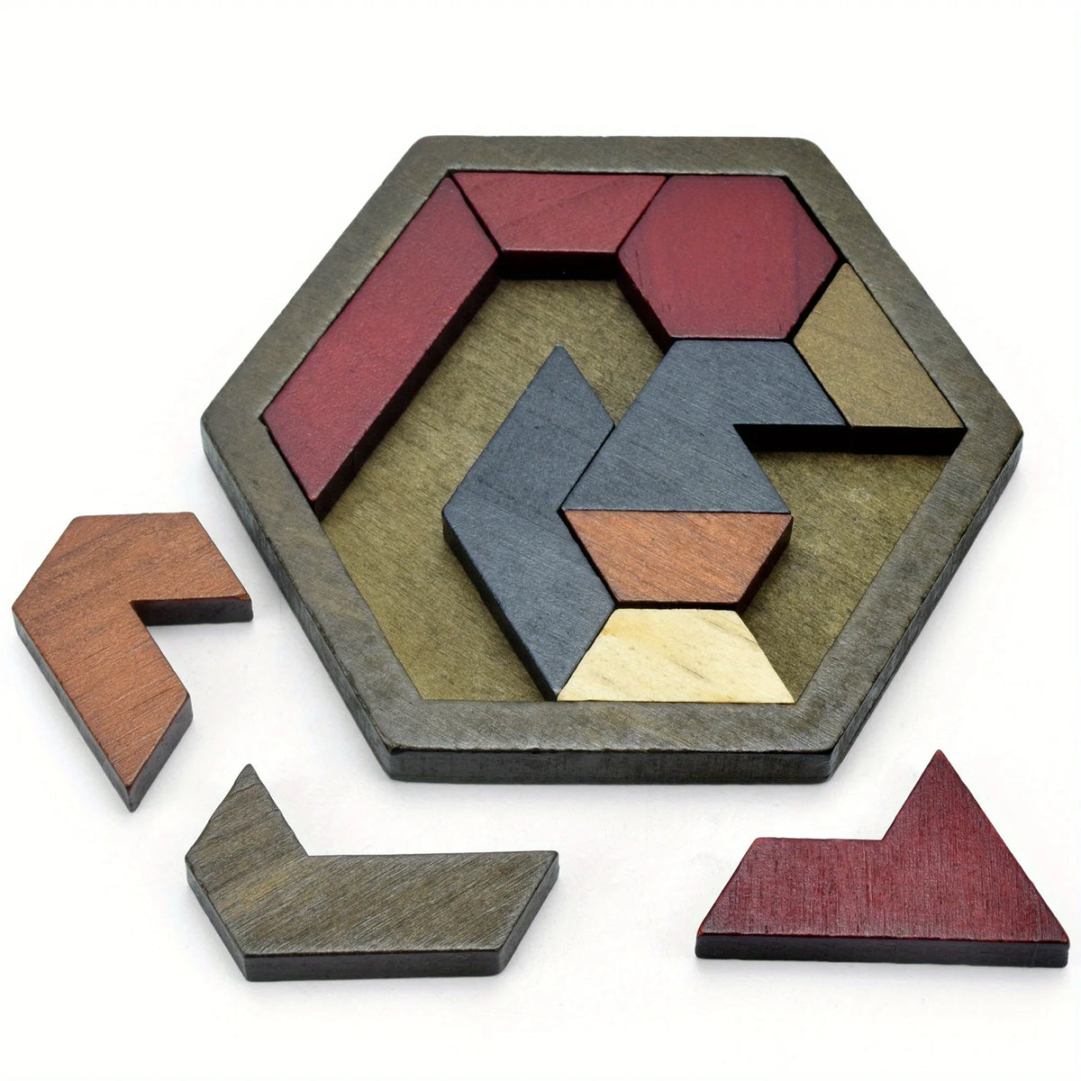 A wooden hexagon puzzle made of interlocking geometric pieces in shades of brown, gray, and red.