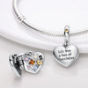 A sterling silver heart pendant charm with various colored gemstones hangs from a silver chain.