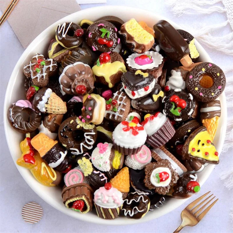 A bowl filled with assorted dark chocolate and colorful candy resin flatbacks for DIY crafts