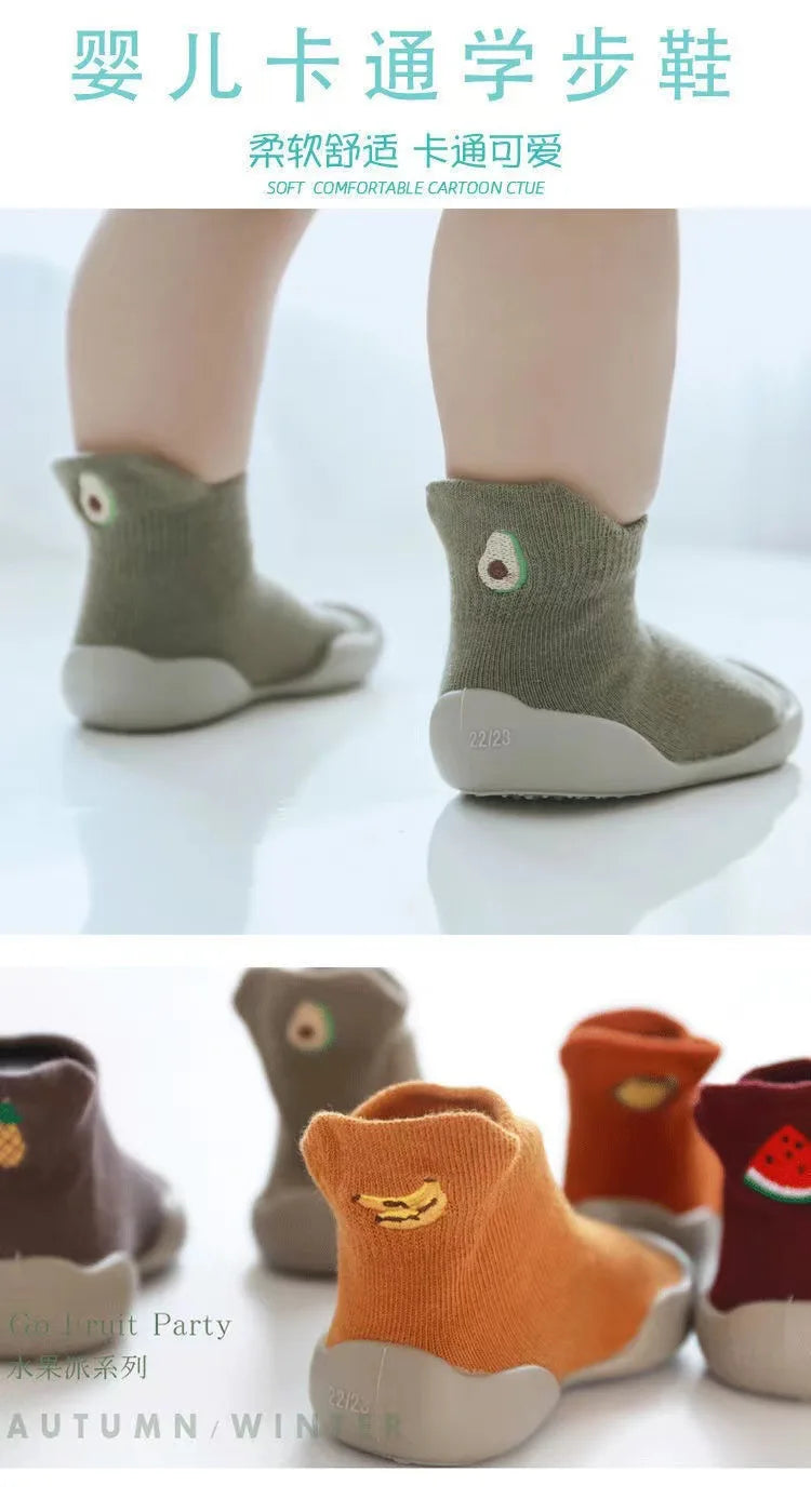 A set of soft-soled baby first walker socks shoes in various earthy tones including olive green, beige, and orange.