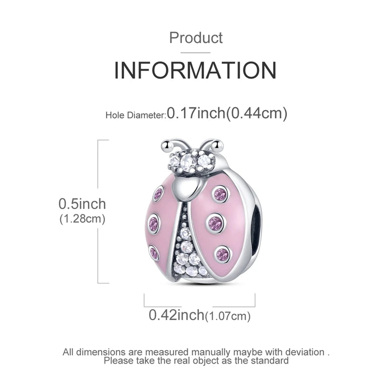 A pink heart-shaped charm made of 925 sterling silver with a textured surface and sparkling details.