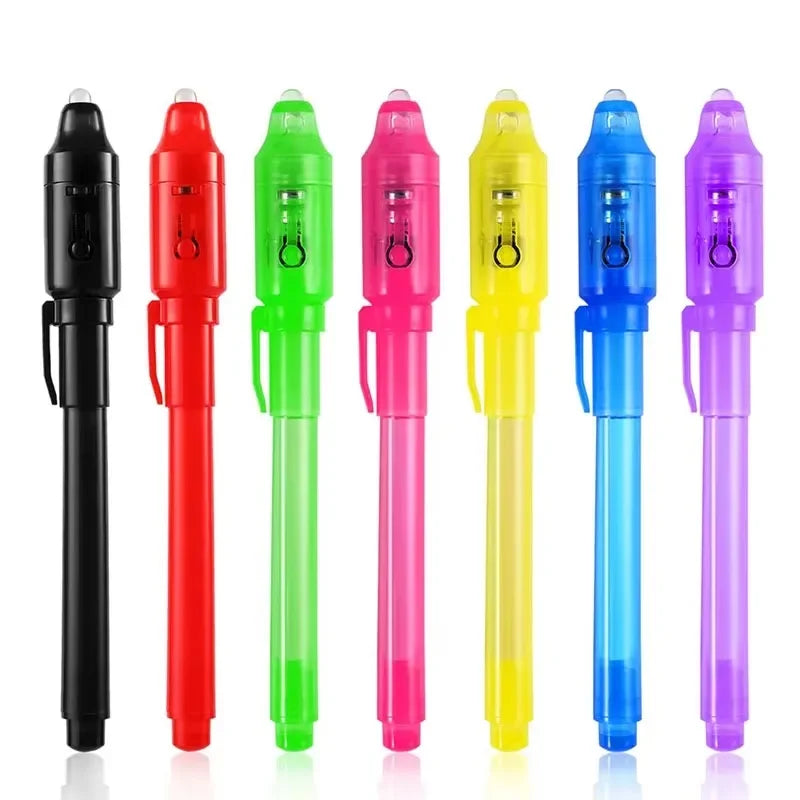 A set of invisible ink spy pens with UV light for writing secret messages in various colors.