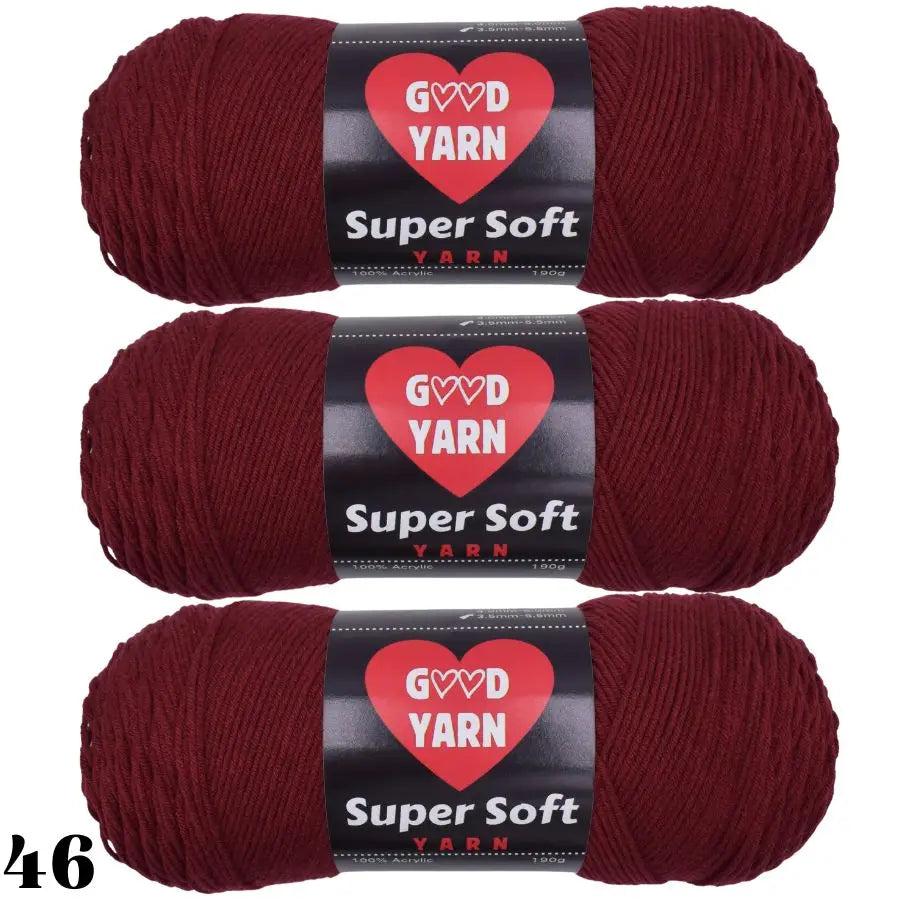Three skeins of deep maroon Super Soft yarn are shown rolled up for crochet and knitting projects.