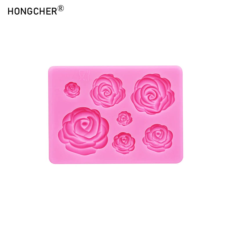 A pink silicone mold featuring various rose and peony flower shapes for resin, jewelry, and baking.