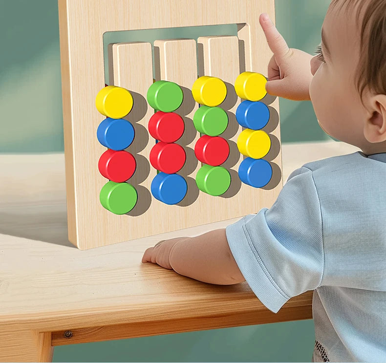 A baby is interacting with a wooden color and shape matching game board featuring colorful circular blocks.