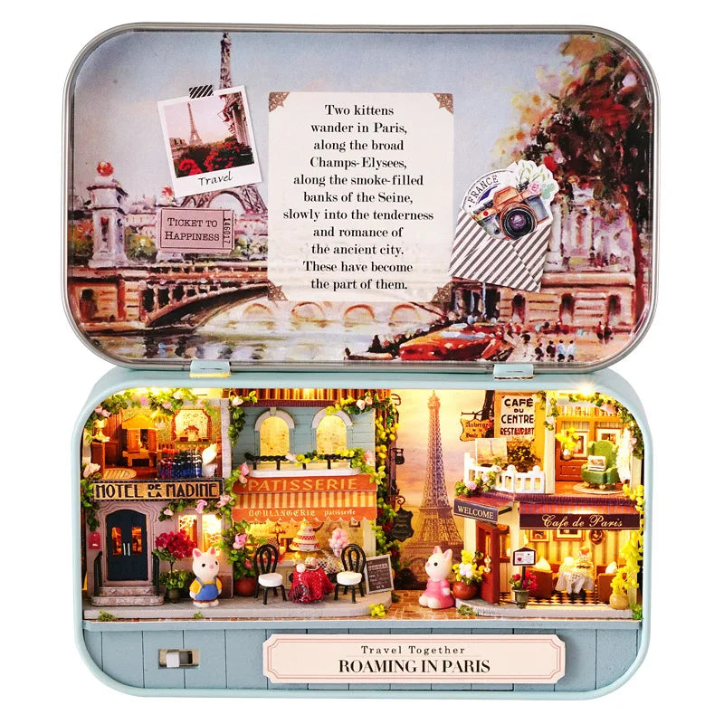 A miniature dollhouse theater kit featuring Parisian scenes and furniture.