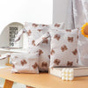 A set of three waterproof bags with brown bear designs for storing swimsuits, diapers, and travel items.