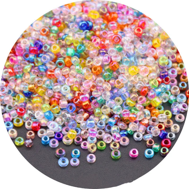A colorful mix of small glass rice beads in various shades including pink, blue, yellow, and orange.