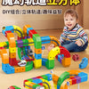 A colorful DIY magic rail cube train set made of interlocking blocks, featuring various colored tracks and a miniature train.