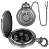 A steampunk dragon pocket watch dice case with a silver metal body and a chain, open to reveal seven small dice inside.
