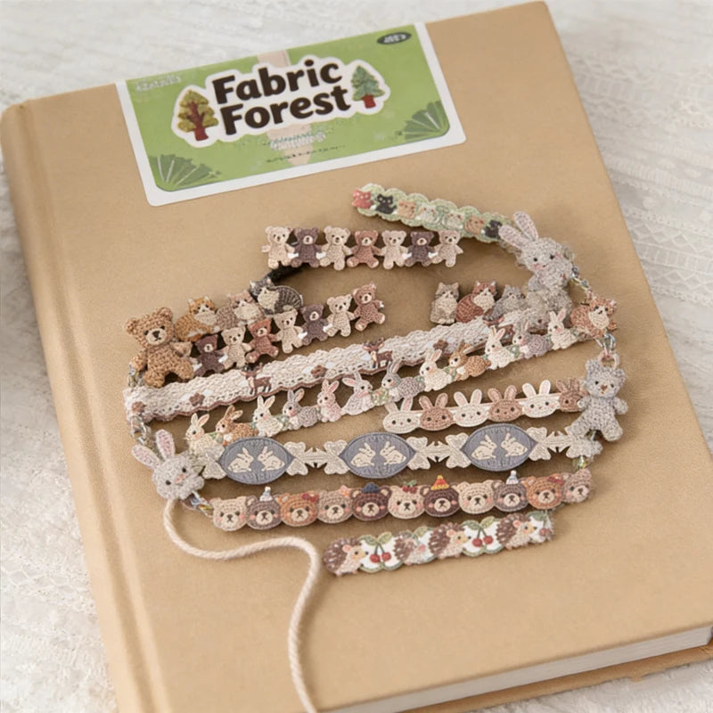 A collection of fabric-textured sticker strips featuring small woodland animals for journaling and scrapbooking.