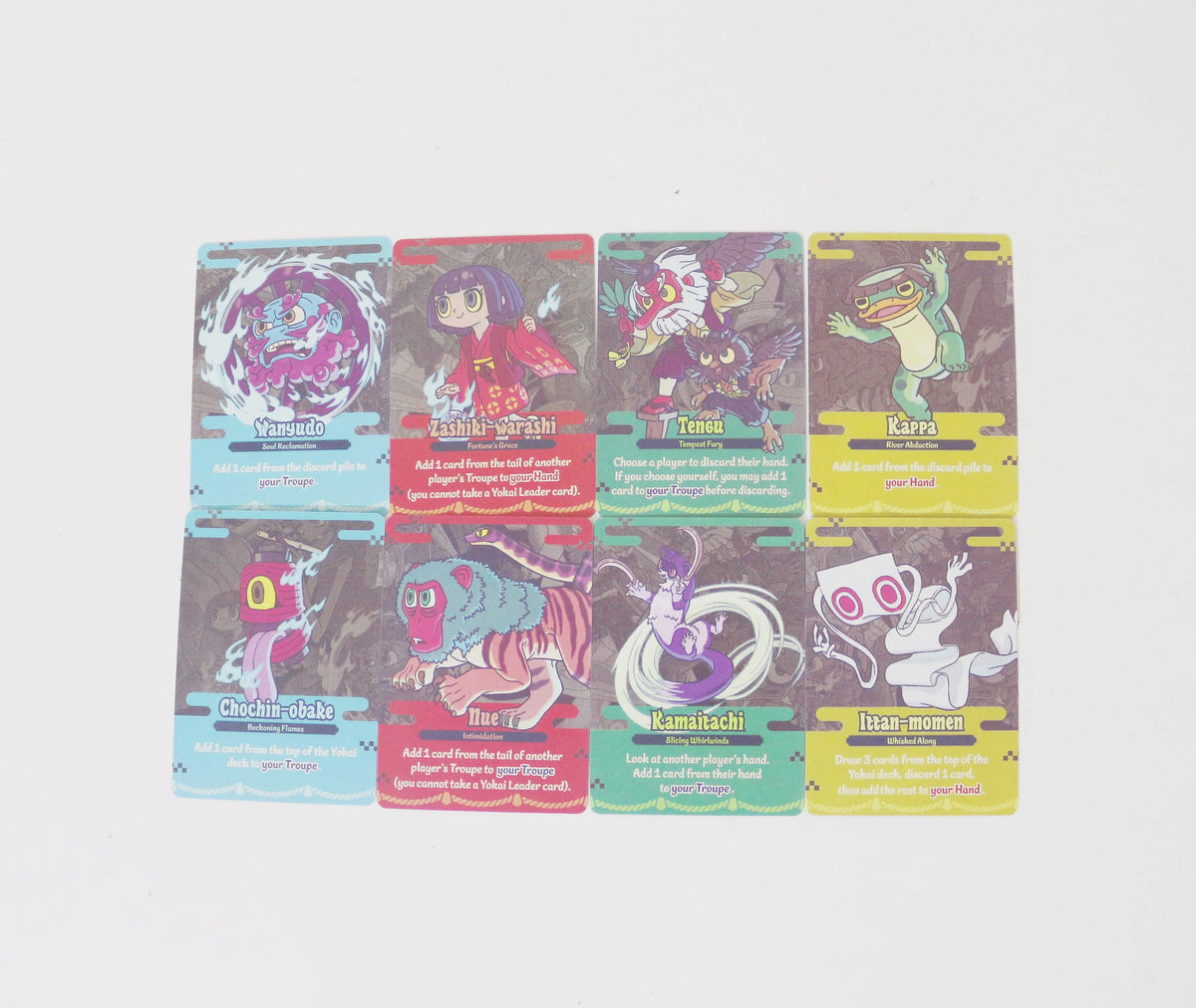 A set of nine cards featuring various yokai characters and abilities for a strategic board game.